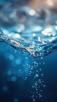 Bubbles rising through clear water create a captivating underwater scene with shimmering light effects photo