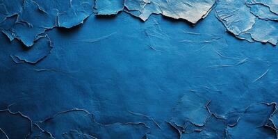 Textured blue background showcasing cracked and peeling layers of material, creating a distinctive visual interest ideal for artistic projects photo