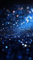 Blue glitter sparkles create an enchanting atmosphere ideal for celebrations and artistic projects during evening events photo