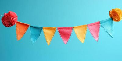 Colorful paper bunting decorates a vibrant backdrop for a festive celebration or event photo