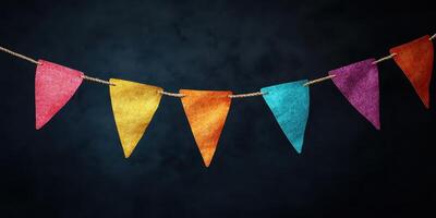 Colorful decorative bunting hanging against a dark background for celebrations and festive events photo