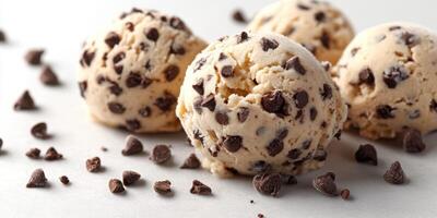 Tasty chocolate chip ice cream scoops on a light background attracting attention during a warm afternoon photo