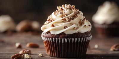 Delicious chocolate cupcake topped with creamy frosting and crushed nuts on a rustic wooden table photo