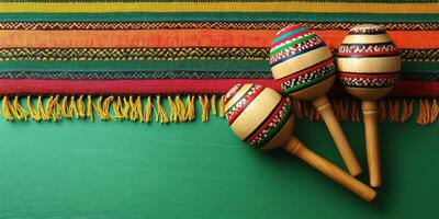 Colorful maracas and vibrant woven fabric create a festive atmosphere for a celebration or cultural event photo
