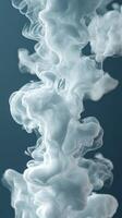 Ethereal wisps of smoke swirling against a dark backdrop creating a mesmerizing visual effect photo