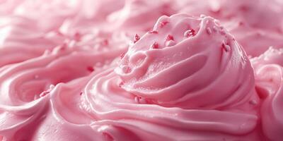 Delicious pink frosting swirled on a dessert with sprinkles and a smooth texture photo