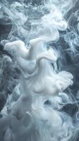 Swirling white smoke forms intricate patterns against a dark background in a captivating display of ethereal beauty photo
