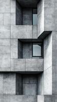 Modern architectural design featuring textured concrete surfaces and angular windows in urban setting photo