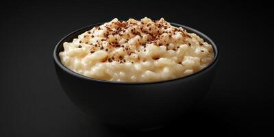 Delicious bowl of creamy rice pudding topped with a sprinkle of cinnamon for a comforting dessert photo