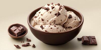 Delicious creamy chocolate chip ice cream served in a brown bowl with chocolate squares photo
