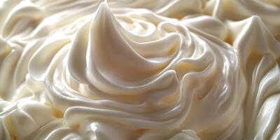 Swirls of creamy texture atop a dessert create an inviting and indulgent experience in a kitchen setting photo