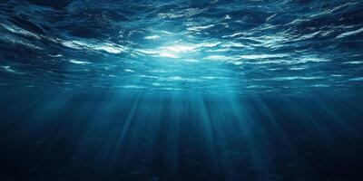 Sunlight filtering through deep ocean waters creating a serene underwater atmosphere in the early morning photo