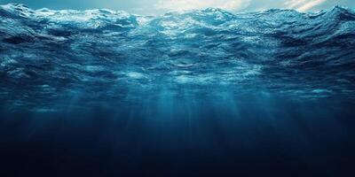 Deep blue ocean water illuminated by sunlight filtering through the surface creating a serene underwater atmosphere photo