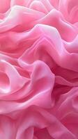 Soft pink fabric drapes elegantly in flowing, textured layers creating a delicate atmosphere photo