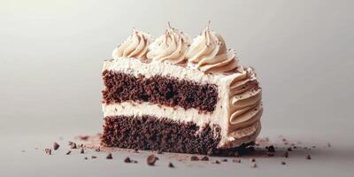 Delicious chocolate cake slice decorated with cream swirls and cocoa powder on a light background photo