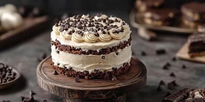 Delicious chocolate cake with creamy frosting and chocolate chips on a rustic wooden table photo
