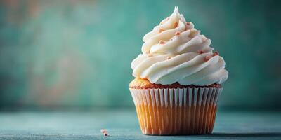 Delicious vanilla cupcake with creamy frosting and decorative sprinkles in a soft light setting photo
