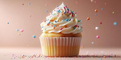 Colorful cupcake with frosting and sprinkles on a soft background at a celebration or party setting during daytime photo