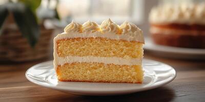 Delicious yellow cake with creamy frosting served on a white plate in a cozy, sunlit kitchen photo
