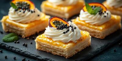 Delicious pastry squares topped with whipped cream, fruit, and dark seeds on a stone serving plate photo