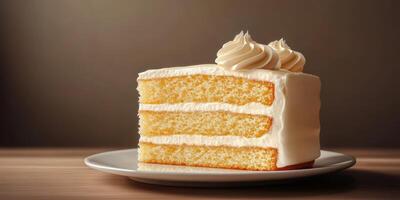 Delicious slice of vanilla cake topped with whipped cream, served on a simple plate in warm lighting photo