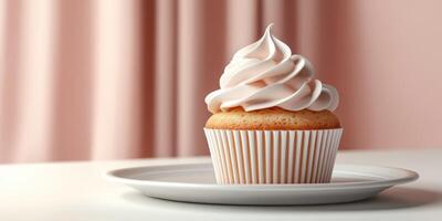 Delicious cupcake with fluffy frosting displayed on a white plate against a soft pink background photo