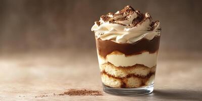 Delicious dessert featuring layered chocolate and cream in a clear glass on a rustic background photo