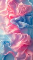 Colorful silk fabric draped softly in shades of pink and blue creating a serene and elegant atmosphere photo
