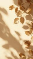 Delicate shadows of golden leaves create an elegant composition on a warm, neutral background in soft afternoon light photo