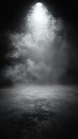 Soft light illuminating a misty, dark space creating a mysterious atmosphere photo