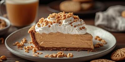Delicious slice of creamy peanut butter pie topped with whipped cream and crushed nuts on a rustic table photo