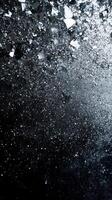 Shimmering shards and sparkling dust create a captivating visual display in a dark backdrop photo