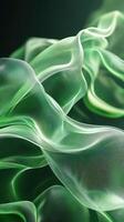 Luminous green fabric flowing gracefully in soft waves photo