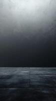 Dark concrete surface and moody background create an atmospheric setting for artistic projects photo