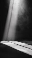 Light beams illuminate a dark space creating dramatic shadows in an artistic setting photo