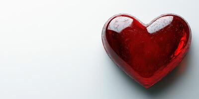 Heart shaped red object resting on a smooth surface showcasing elegance and love photo