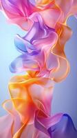 Colorful fabric waves create a mesmerizing abstract display against a soft blue background, evoking a sense of fluid movement and elegance photo