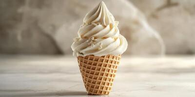 Creamy vanilla soft serve ice cream in a waffle cone on a marble countertop photo