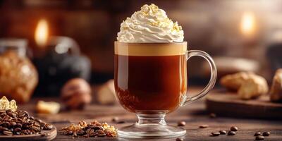 Warm coffee drink topped with whipped cream and caramel sits on a rustic wooden table surrounded by coffee beans and pastries photo