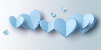 Decorative blue hearts in various sizes creating a minimalist wall art layout suitable for celebrations or romantic themes photo