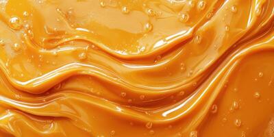 Rich golden caramel sauce swirls and bubbles tempt the senses in a close-up view photo