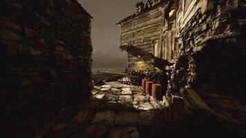 Exploring a dark alleyway leading to the shore during twilight hours video