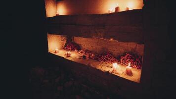 Candles and offerings illuminate a tranquil space in a sacred setting video