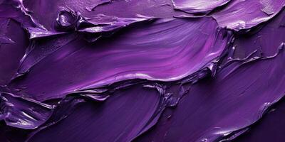 Vibrant purple paint swirls creating a textured abstract composition in a studio setting photo