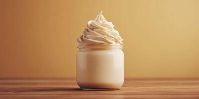 Creamy dessert in a glass jar topped with rich swirls of whipped cream against a golden background photo