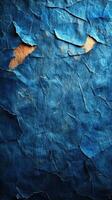 Deep blue textured paper with worn edges showcasing layers and contrasts of color and texture in natural light photo