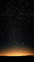 Starry night sky over a quiet horizon with shimmering stars and a soft glow at dusk photo