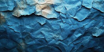 Crumpled blue paper with textured surface suggesting depth and character in artistic design photo