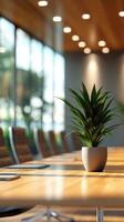 Modern conference room with greenery during daylight, featuring a wooden table setup for meetings photo