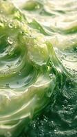 Dynamic green waves with bubbles creating a stunning underwater visual in bright light photo